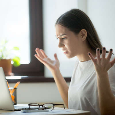 Millennial generation woman looking in laptop computer, fling ar